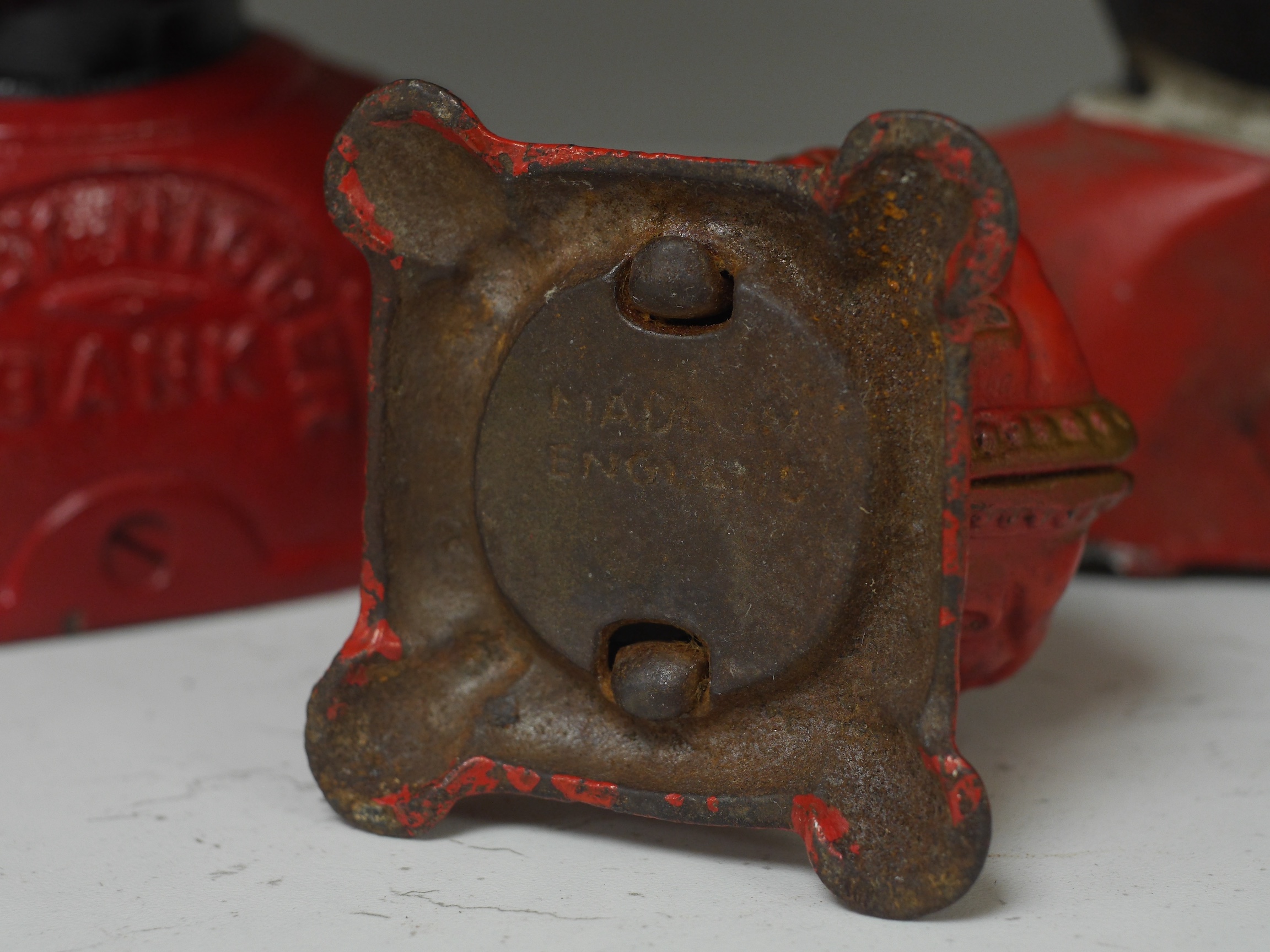 Six various metalware money boxes to include to jolly money banks, standing bear and one in the form of a crown. Condition - fair with general wear